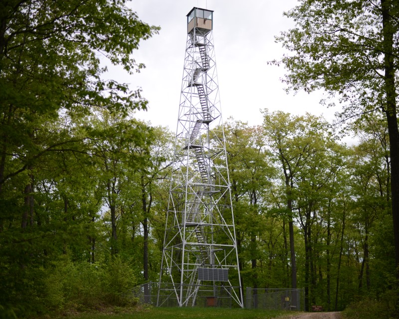 The Fire Tower, a metal tower with a massive set of stairs that leads up to the cabin on top.