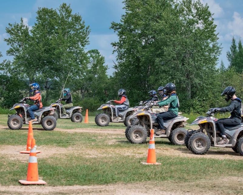 A group of staff and Scouts walking down a dirt trail